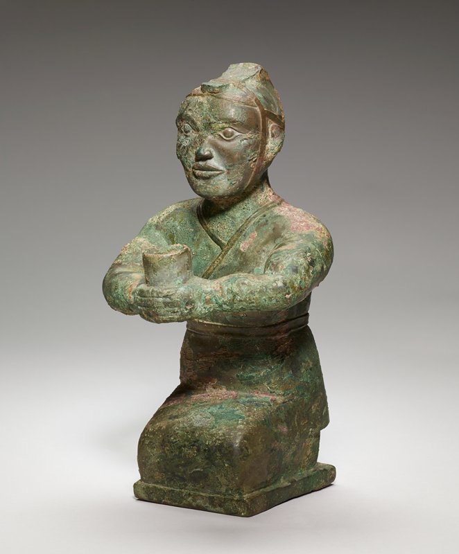 Kneeling figure