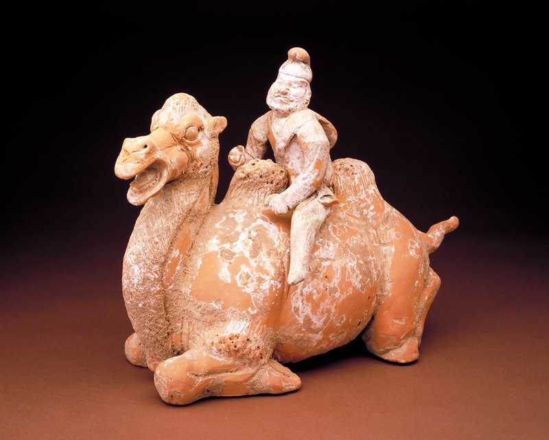 Tomb figure of a kneeling camel with driver